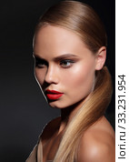 Young woman with straight hair on dark background. Portrait. Стоковое фото, фотограф Iryna Hramavataya / PantherMedia / Фотобанк Лори