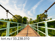 Walkway at suspension bridge across the island. Стоковое фото, фотограф Phongkit Longthong / PantherMedia / Фотобанк Лори