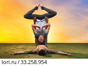 The two people doing yoga exercises. Стоковое фото, фотограф Volodymyr Melnyk / PantherMedia / Фотобанк Лори