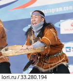 Aboriginal dancer in national clothes of native people emotional dancing with tambourine. Concert Koryak Dance Ensemble Mengo (2019 год). Редакционное фото, фотограф А. А. Пирагис / Фотобанк Лори