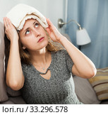 Woman with wet towel on her forehead. Стоковое фото, фотограф Яков Филимонов / Фотобанк Лори
