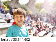 Happy smiling boy on the stadium during sport game. Стоковое фото, фотограф Сергей Новиков / Фотобанк Лори
