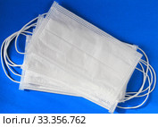 Antiviral mask on blue background. Protective masks. Стоковое фото, фотограф Попова Ольга / Фотобанк Лори