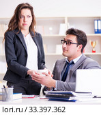 Sexual harassment concept with man and woman in office. Стоковое фото, фотограф Elnur / Фотобанк Лори