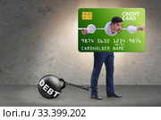 Businessman in credit card burden concept in pillory. Стоковое фото, фотограф Elnur / Фотобанк Лори