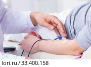 Patient getting blood transfusion in hospital clinic. Стоковое фото, фотограф Elnur / Фотобанк Лори