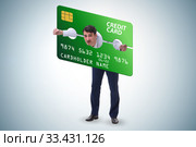 Businessman in credit card burden concept in pillory. Стоковое фото, фотограф Elnur / Фотобанк Лори