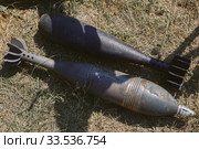 Two unexploded aerial bombs lie on the ground. Стоковое фото, фотограф Олег Белов / Фотобанк Лори