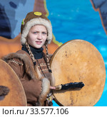Female child dancing with tambourine in tradition clothing indigenous inhabitants Kamchatka Peninsula. Celebration Koryak national holiday Day of Seal - Hololo (2018 год). Редакционное фото, фотограф А. А. Пирагис / Фотобанк Лори