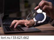 Male hacker hacking security firewall late in office. Стоковое фото, фотограф Elnur / Фотобанк Лори