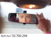 Lady looking back while reversing. Стоковое фото, фотограф Matej Kastelic / Фотобанк Лори
