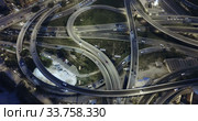 Aerial view of lighted highway road junctions at night. Стоковое видео, видеограф Яков Филимонов / Фотобанк Лори