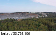 Aerial video view of mining quarry. Excavator loads crushed stone in open pit. Стоковое видео, видеограф Сергей Пристяжнюк (Serg Zastavkin) / Фотобанк Лори