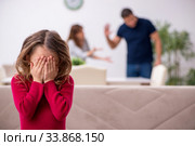 Young couple and their daughter in family conflict concept. Стоковое фото, фотограф Elnur / Фотобанк Лори