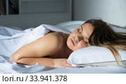 Young female in pygamas is sleeping on bed. Стоковое фото, фотограф Яков Филимонов / Фотобанк Лори
