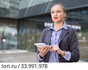 Female testing digital tablet in the modern city. Стоковое фото, фотограф Яков Филимонов / Фотобанк Лори