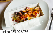 Plate of spanish dish Pulpo a la Gallega. Стоковое фото, фотограф Яков Филимонов / Фотобанк Лори