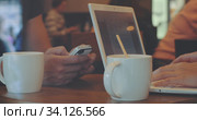 Man and woman work in cafe using gadgets. Стоковое фото, фотограф Данил Руденко / Фотобанк Лори