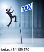 Businessman jumping over tax in tax evasion avoidance concept. Стоковое фото, фотограф Elnur / Фотобанк Лори