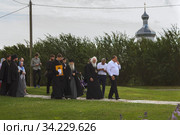 Russia, Veliky Novgorod, Yuriev monastery-July 14, 2020: Archimandrite Eli (Nozdrin), Metropolitan Lev of Novgorod and old Russia, Bishop Arseny of Yuriev, together with the brethren of the monastery, leave St. George's Cathedral after the prayer service. Редакционное фото, фотограф Филатова Ирина / Фотобанк Лори