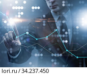 BUsinessman pressing virtual button on diagram chart. Стоковое фото, фотограф Elnur / Фотобанк Лори