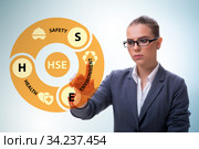 HSE concept with businesswoman pressing virtual button. Стоковое фото, фотограф Elnur / Фотобанк Лори