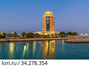 Doha, Qatar - Nov 17. 2019. The Ritz-Carlton hotel in night. Редакционное фото, фотограф Володина Ольга / Фотобанк Лори