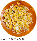 Tortellini garnished with grated cheese and pignoli. Стоковое фото, фотограф Яков Филимонов / Фотобанк Лори