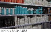 Assortment of haircare products and wigs at cosmetics store (2020 год). Редакционное видео, видеограф Яков Филимонов / Фотобанк Лори