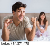 Man suffering from impotency with pill. Стоковое фото, фотограф Elnur / Фотобанк Лори