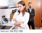 Upset girl with husband in kitchen furniture salon. Стоковое фото, фотограф Яков Филимонов / Фотобанк Лори