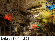 Russia, Sochi, Vorontsovskie caves, August 08, 2020: Narrow passage with RGB-lighting. Стоковое фото, фотограф Магадеева Елена / Фотобанк Лори