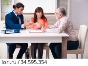 Young male lawyer, old man and his granddaughter in testament co. Стоковое фото, фотограф Elnur / Фотобанк Лори