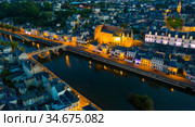 Evening aerial view of Laval with buildings, river Mayenne and old bridge. Стоковое фото, фотограф Яков Филимонов / Фотобанк Лори