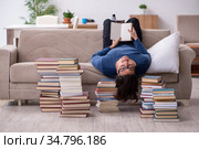 Young male student preparing for exams at home. Стоковое фото, фотограф Elnur / Фотобанк Лори