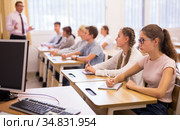 Teenage students working at class during lesson. Стоковое фото, фотограф Яков Филимонов / Фотобанк Лори