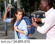 Street thief running away after stealing purse. Стоковое фото, фотограф Яков Филимонов / Фотобанк Лори