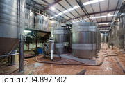 Stainless cisterns with fermenting wine in fabric. Стоковое фото, фотограф Яков Филимонов / Фотобанк Лори