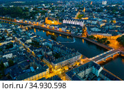 Evening aerial view of Laval with buildings, river Mayenne and old bridge. Стоковое фото, фотограф Яков Филимонов / Фотобанк Лори