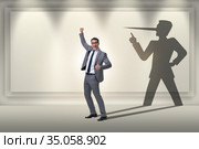 Concept of businessman liar with his shadow. Стоковое фото, фотограф Elnur / Фотобанк Лори