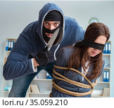 Criminal taking businesswoman as hostage in office. Стоковое фото, фотограф Elnur / Фотобанк Лори