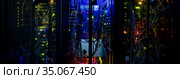 Server rack cluster in a data center horizontal view. Стоковое фото, фотограф Alexander Tihonovs / Фотобанк Лори