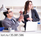 Sexual harassment concept with man and woman in office. Стоковое фото, фотограф Elnur / Фотобанк Лори