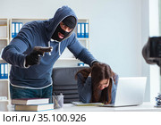 Criminal recording message for ransom with victim businesswoman. Стоковое фото, фотограф Elnur / Фотобанк Лори