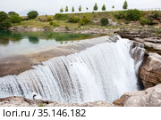 Plain waterfall of the Cijevna river. It is called Montenegrin Niagara Falls. Surroundings of Podgorica city. Montenegro, Europe. Стоковое фото, фотограф Кекяляйнен Андрей / Фотобанк Лори