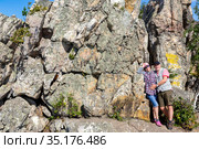 a mature sports couple on the top of Aleksandrovskaya Sopka mountain near the town of Zlatoust in the Chelyabinsk region in Russia. Стоковое фото, фотограф Акиньшин Владимир / Фотобанк Лори