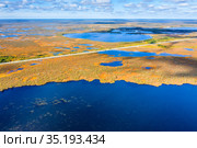 Autumn landscape. West Siberian Plain. Aerial view. Road through endless forests and swamps in Western Siberia. Стоковое фото, фотограф Икан Леонид / Фотобанк Лори