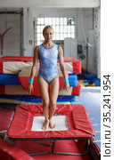 Woman trampolining in acrobatic hall. Стоковое фото, фотограф Яков Филимонов / Фотобанк Лори