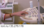 Health diagnostics. Work on an ultrasound diagnostic device, ultrasound examination. Close-up of hands of doctor working on ultrasound device in medic clinic. Стоковое видео, видеограф Константин Мерцалов / Фотобанк Лори