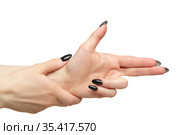 Female hands with black nails manicure isolated on white background. Hands in the shape of a pistol. Стоковое фото, фотограф Сергей Пристяжнюк (Serg Zastavkin) / Фотобанк Лори